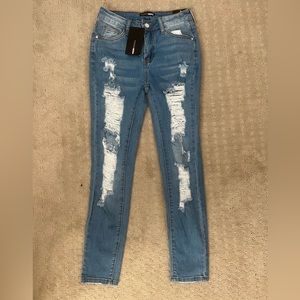 Light blue wash skinny ripped jeans